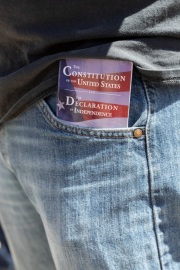 A protester with the US constitution on his pocket  in front of the California State Capitol in Sacramento, CA, on May 1, 2020.