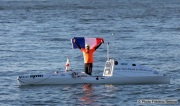 Kayaker Cyril Derreumaux waves a French flag during training in the San Francisco Bay on February 25, 2021.France-born American entrepreneur Cyril Derreumaux (44) will leave at the end of May 2021 for a 70-day solo and unsupported sea kayak Pacific crossing from California to Hawaii.